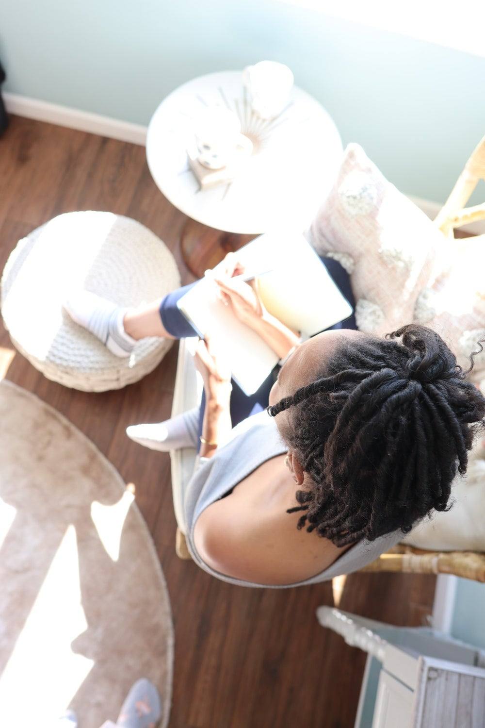 A young woman writing in her journal